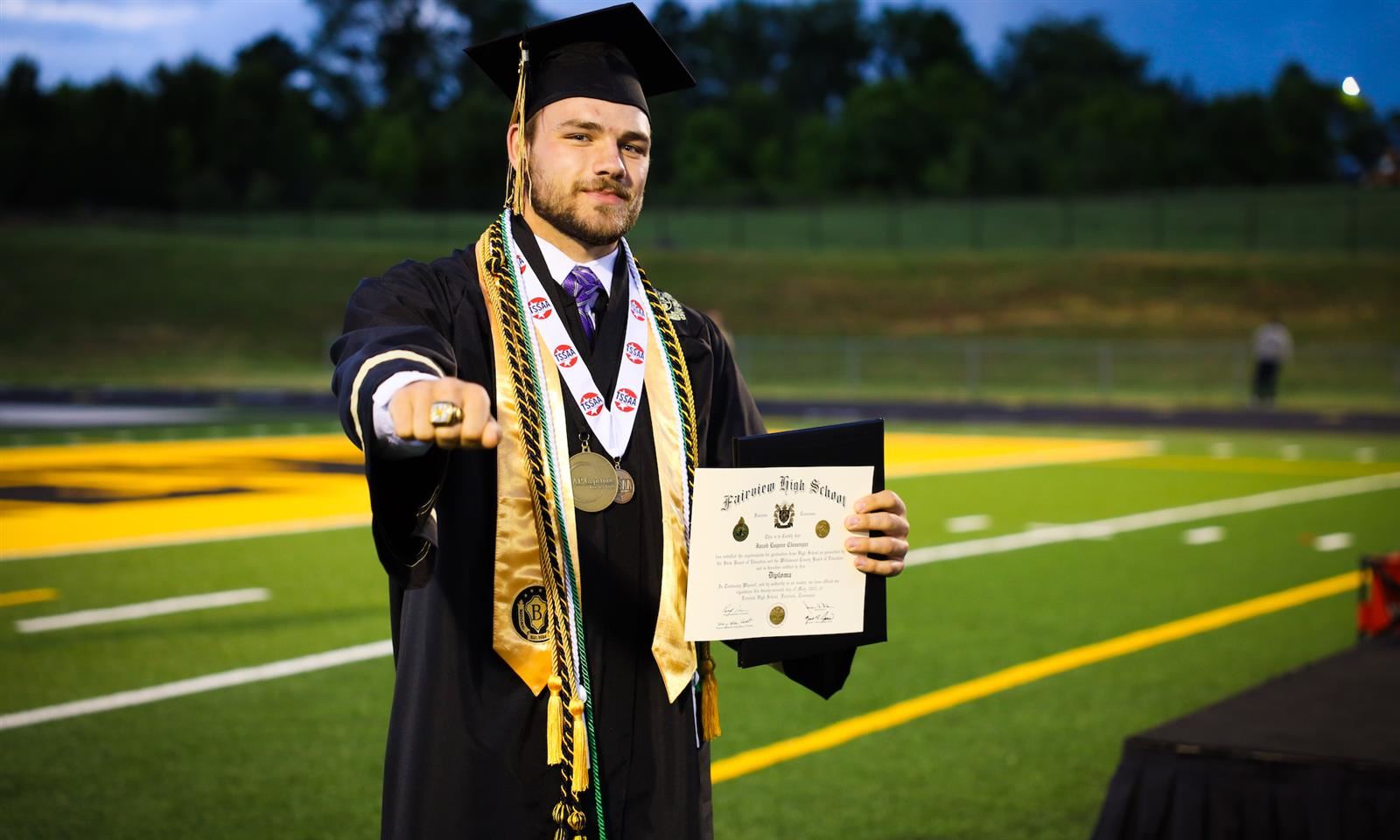 Fairview High student wearing graduation robes